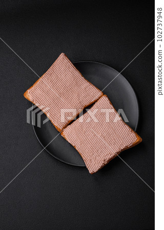 Delicious crispy toast with chicken or goose pate with salt and spices Delicious crispy toast with chicken or goose pate with salt and spices 102737948