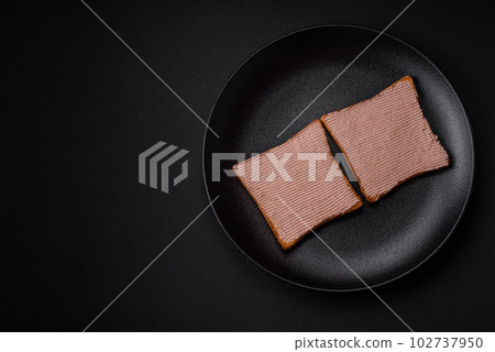 Delicious crispy toast with chicken or goose pate with salt and spices Delicious crispy toast with chicken or goose pate with salt and spices 102737950