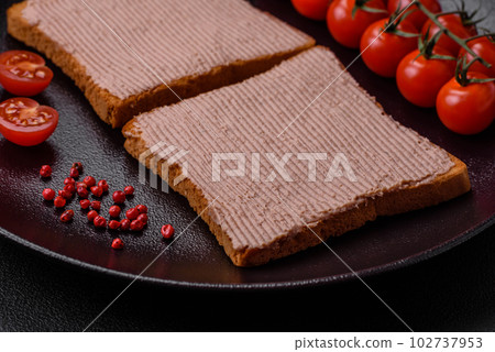 Delicious crispy toast with chicken or goose pate with salt and spices 102737953