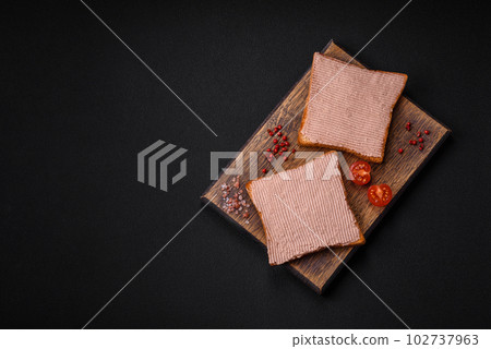 Delicious crispy toast with chicken or goose pate with salt and spices Delicious crispy toast with chicken or goose pate with salt and spices 102737963