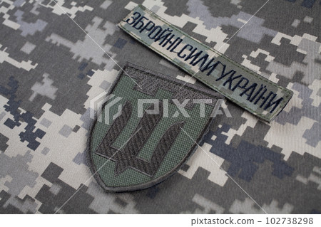 KYIV, UKRAINE - October 6, 2022. Russian invasion in Ukraine 2022. Territorial Defence Forces of Ukraine uniform insignia badge. Text in ukrainian - Armed Forces of Ukraine. 102738298