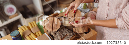 Close up of woman working in home decor studio with elements of interior decorations 102738840