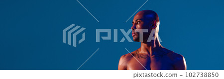 Muscular man doing exercise with weight dumbbells on studio background. Strength and motivation Muscular man doing exercise with weight dumbbells on studio background. Strength and motivation 102738850