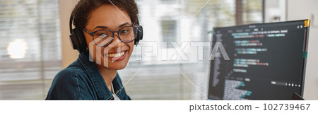 Afro american woman in headphones freelance data scientist work remotely at home office Afro american woman in headphones freelance data scientist work remotely at home office 102739467