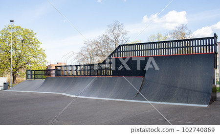 Extreme sports ramps in the city park. Horizontal banner 102740869