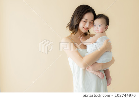 A mother holding a baby A mother holding a baby 102744976