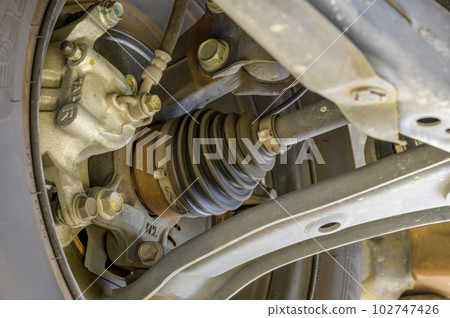 Auto repair shop - front tire viewed from the inside Auto repair shop - front tire viewed from the inside 102747426