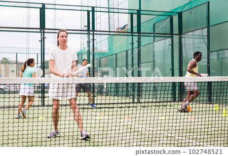 Portrait of focused woman during padel training Portrait of focused woman during padel training 102748521