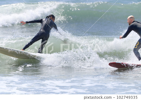 A man who enjoys surfing A man who enjoys surfing 102749335