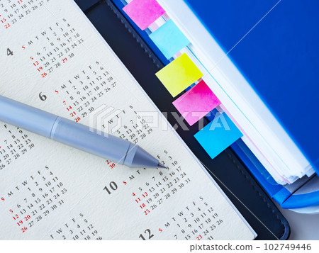 Files and calendars on the table Files and calendars on the table 102749446
