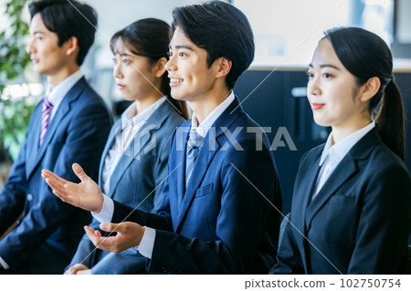 Job hunting young men and women interview Job hunting young men and women interview 102750754