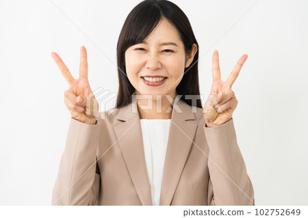 Young woman doing a peace sign business image 102752649