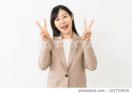 Young woman doing a peace sign business image 102752650