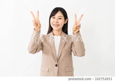 Young woman doing a peace sign business image 102752651