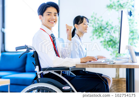 Young man in a wheelchair with a disability Young man in a wheelchair with a disability 102754175