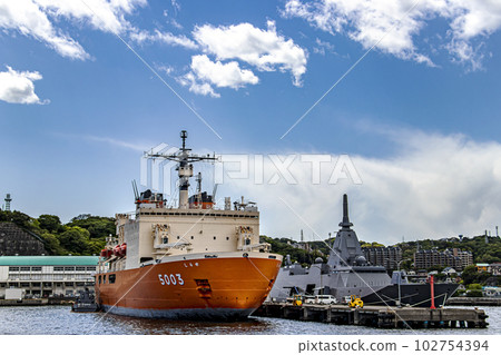 Antarctic research icebreaker Shirase and stealth destroyer Kumano anchored at Maritime Self-Defense Force Yokosuka base 102754394