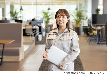 Woman in work clothes working in a creative office 102755737
