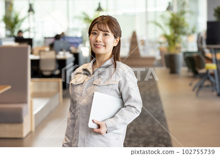 Woman in work clothes working in a creative office Woman in work clothes working in a creative office 102755739