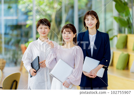 Business woman working in a fashionable designer's office Business woman working in a fashionable designer's office 102755907