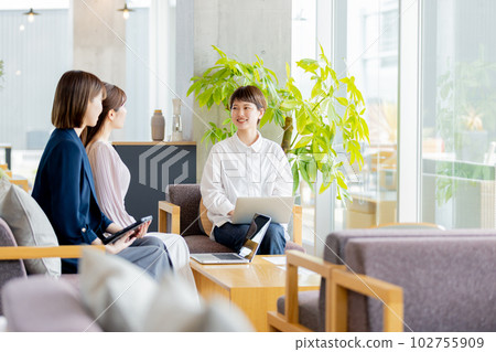 Business woman working in a fashionable designer's office Business woman working in a fashionable designer's office 102755909