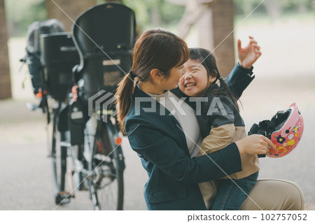 A 4-year-old child who dislikes wearing a bicycle helmet A 4-year-old child who dislikes wearing a bicycle helmet 102757052