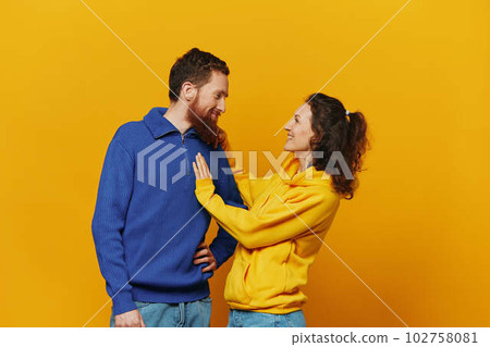 Man and woman couple smile and happiness, yellow background, family  102758081