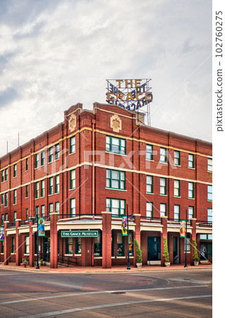 A vibrant town skyline of Abilene, Texas featuring the Grace Museum amongst residential buildings and a mix of modern architecture. A vibrant town skyline of Abilene, Texas featuring the Grace Museum amongst residential buildings and a mix of modern architecture. 102760275