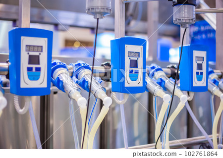 Automated goat milking suction machine with teat cups at exhibition 102761864