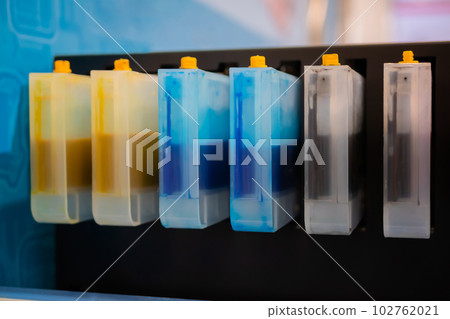 Row of inkjet printer CMYK cartridges - close up Row of inkjet printer CMYK cartridges - close up 102762021