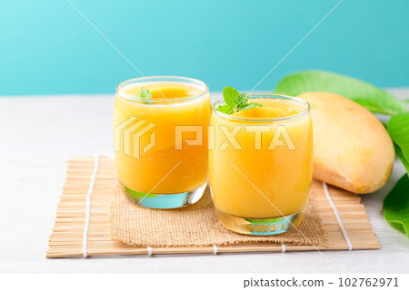 Fresh mango smoothie in glass, Cold drink in summer season 102762971