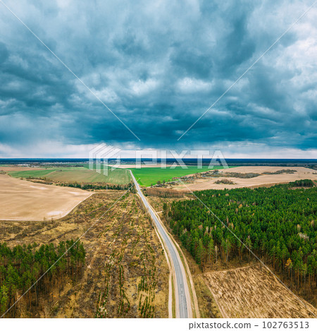 Aerial View Of Highway Road Through Deforestation Area Landscape. Green Pine Forest In Deforestation Zone. Top View Of Field And Forest Landscape. Drone View. Bird's Eye View. Aerial View Of Highway Road Through Deforestation Area Landscape. Green Pine Forest In Deforestation Zone. Top View Of Field And Forest Landscape. Drone View. Bird's Eye View. 102763513
