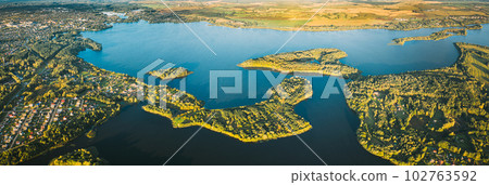 Lyepyel, Lepel Lake, Beloozerny District, Vitebsk Region. Aerial View Of Lyepyel Cityscape Skyline In Autumn Morning. Morning Fog Above Lepel Lake. Top View Of European Nature From High Attitude In 102763592