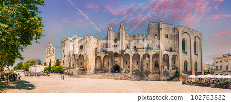 Avignon, Provence, France. Panorama of Ancient Popes Palace, Saint-Benezet, Avignon, Provence, France. Famous landmark. Altered Sunset Sunrise Sky 102763882