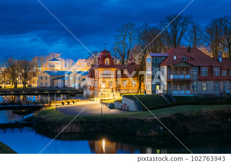 Kuressaare, Estonia. Old Wooden Mansion Ekesparre Boutique Hotel In Wooden Art Nouveau In Evening Blue Hour Night. Amazing Bold Bright Blue Starry Sky Gradient Above Traditional Medieval Architecture 102763943