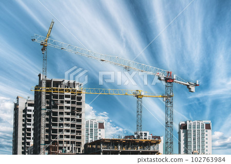 Amazing Bright Blue Sky Above Construction Crane. Construction And Development Of New Multi-storey Residential. Conception Of Development. New Accommodation 102763984