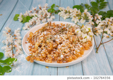 Acacia flowers fritters, Blossoming acacia with leafs, , Robinia pseudoacacia, White acacia 102764356
