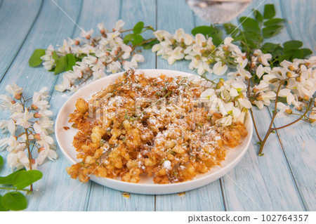 Acacia flowers fritters, Blossoming acacia with leafs, , Robinia pseudoacacia, White acacia 102764357