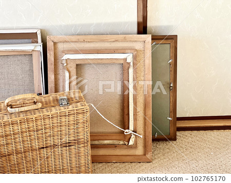 The back of some picture frames and the basket The back of some picture frames and the basket 102765170