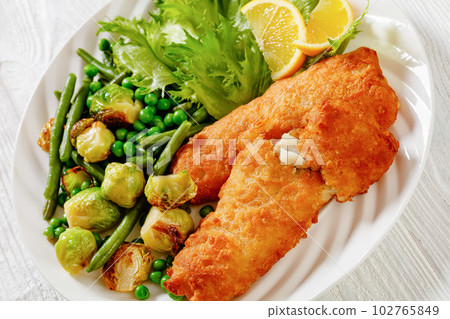 Crispy Beer Batter Cod Fish with green  vegetables 102765849