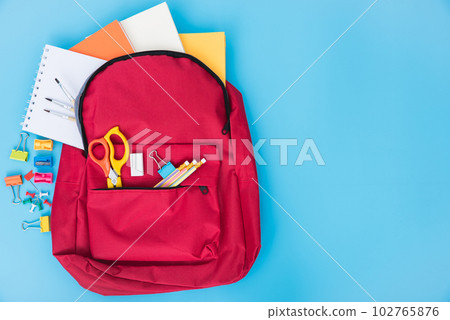 Top view flat lay of red school bag backpack and accessories tools for children education on blue background, Back to school concept and have copy space for use 102765876