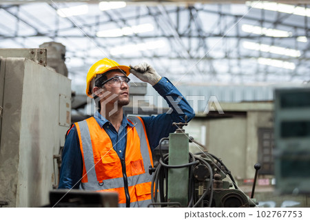 engineering worker man wearing uniform safety and hardhat working machine lathe metal in factory 102767753