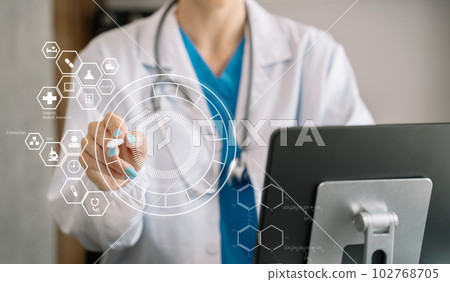 Doctor work on digital tablet healthcare doctor technology tablet using computer in a modern office  in the morning at the desk. 102768705