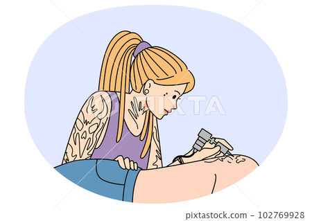 Woman artist draw ink tattoo on client body Woman artist draw ink tattoo on client body 102769928