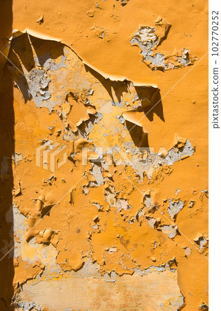 Texture background of a peeling orange paint 102770252