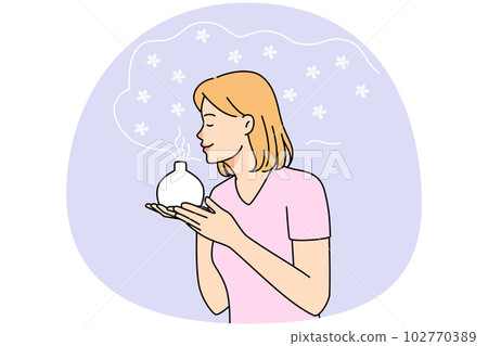 Young woman smell fragrance from aromatherapy diffuser 102770389