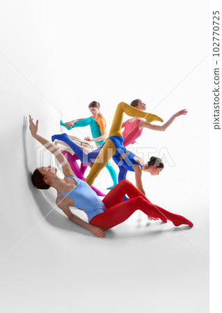 Creative performance. Young girls, ballet dancer in bright tights and bodysuits dancing against grey studio background 102770725