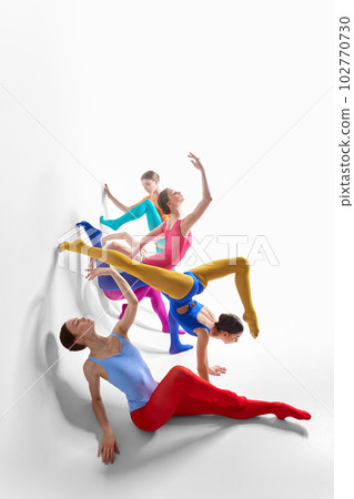 Expression. Young girls, ballet dancer in bright tights and bodysuits dancing against grey studio background 102770730