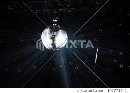 Disco mirror ball hanging at a retro party Disco mirror ball hanging at a retro party 102771041