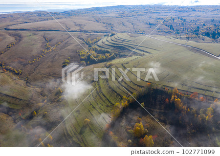 Above aerial view of countryside meadow in the autumn 102771099
