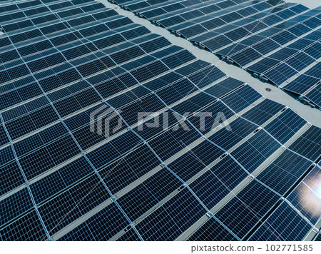 Close-up of Solar cell farm power plant eco technology. Landscape of Solar cell panels in a photovoltaic power plant. Concept of sustainable resources and renewable energy.blue tone. 102771585
